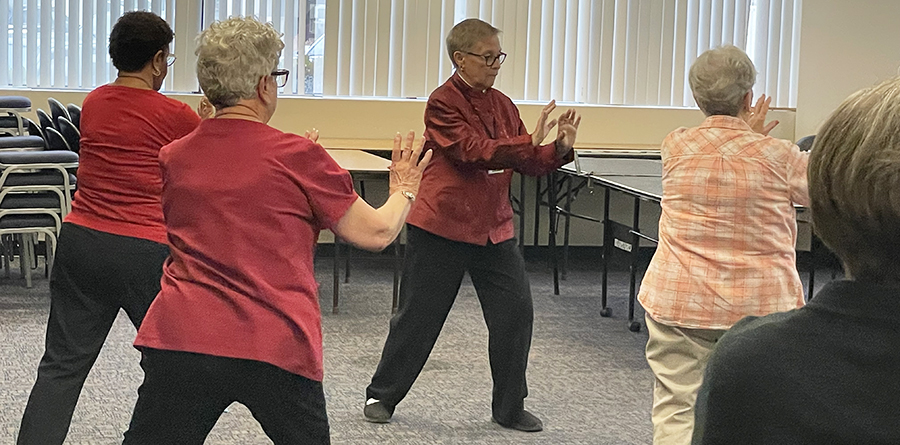 photo of Tai Chi instructor and participants in class